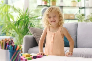 Young child practicing early learning and play skills at home, representing early signs that may benefit from ABA therapy