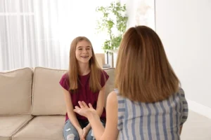 Teen participating in ABA therapy session focused on communication and social interaction skills