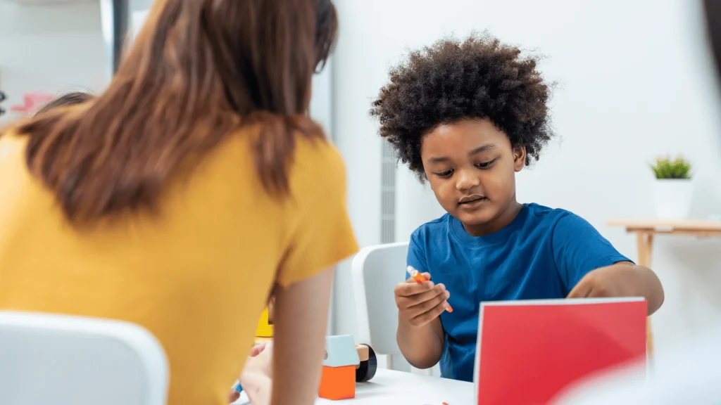 Child working with an ABA therapist in a Manassas VA therapy setting