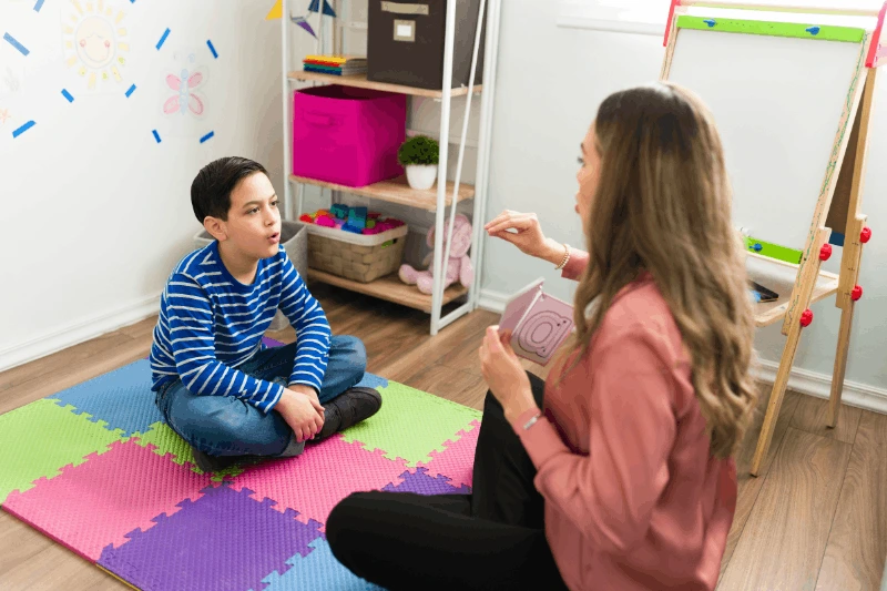Child practicing communication skills during ABA therapy in Herndon VA