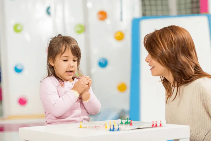 Child practicing play and communication skills with an ABA therapy provider