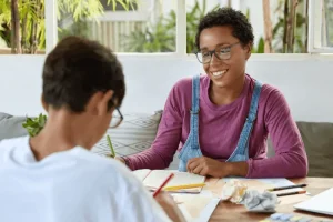 Teen working with a therapist on life skills during ABA therapy in Herndon, VA