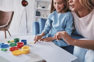 Parent and child painting together during a creative activity at home
